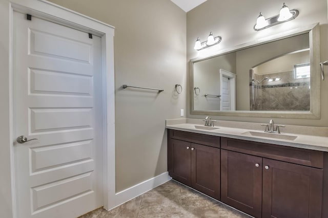 16803 Amelia Island Dr, Cypress, TX 77433 - full bathroom featuring double vanity, a tile shower, and tile patterned floors