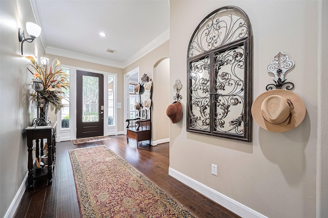 9427 Fern Wood Frst, Houston, TX 77040 - entryway with dark wood-style floors, crown molding, and arched walkways