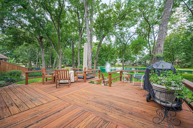 9427 Fern Wood Frst, Houston, TX 77040 - wooden terrace featuring view of scattered trees, a water view, and a grill