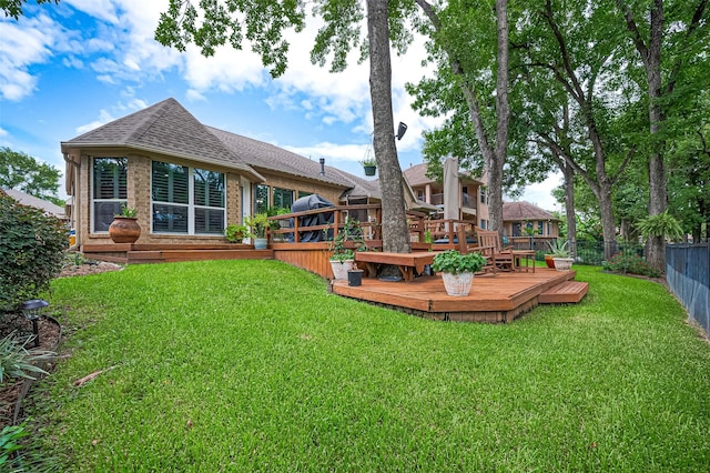 9427 Fern Wood Frst, Houston, TX 77040 - back of house featuring roof with shingles, a fenced backyard, a wooden deck, and brick siding