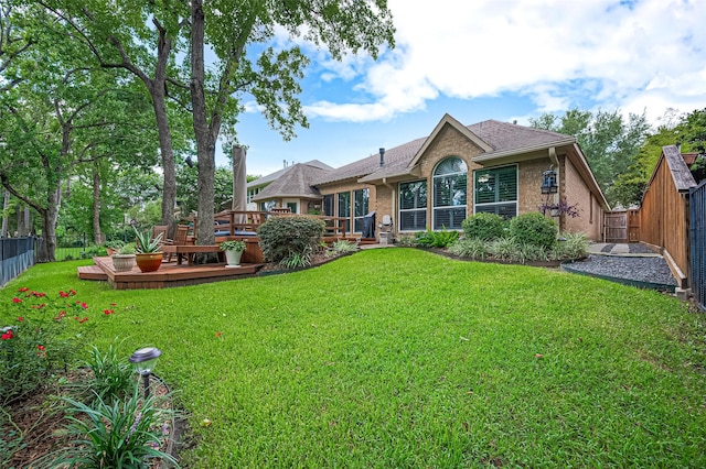 9427 Fern Wood Frst, Houston, TX 77040 - back of property with a wooden deck, brick siding, a fenced backyard, and a shingled roof