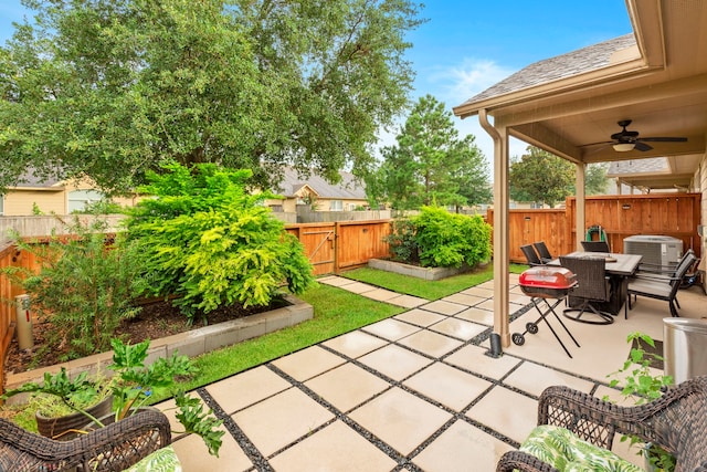 9707 Old Timber Ln, Spring, TX 77379 - fenced backyard featuring ceiling fan, a patio area, outdoor dining area, and a gate
