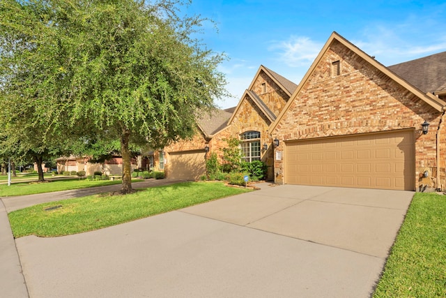 9707 Old Timber Ln, Spring, TX 77379 - view of front of property with driveway, brick siding, a front yard, a shingled roof, and an attached garage