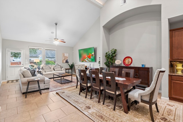 9707 Old Timber Ln, Spring, TX 77379 - dining space with ceiling fan, light tile patterned floors, and high vaulted ceiling
