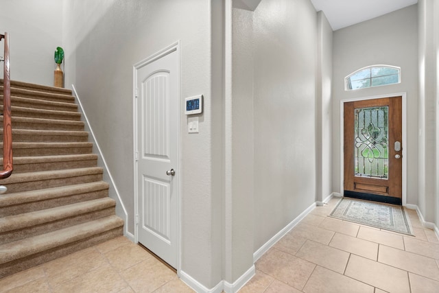 9707 Old Timber Ln, Spring, TX 77379 - entrance foyer with stairway and light tile patterned floors