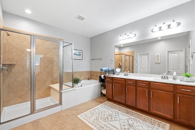 9707 Old Timber Ln, Spring, TX 77379 - bathroom featuring double vanity, a bath, a shower stall, tile patterned floors, and recessed lighting