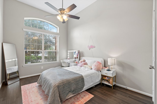9707 Old Timber Ln, Spring, TX 77379 - bedroom featuring multiple windows, dark wood-style floors, lofted ceiling, and a ceiling fan