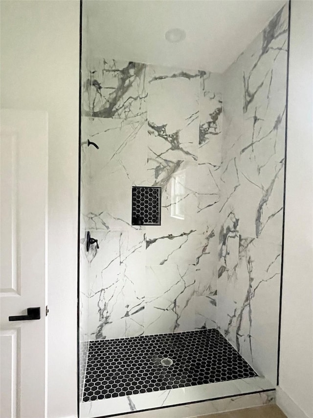 11735 Fleming Dr, Houston, TX 77013 - full bathroom featuring a marble finish shower