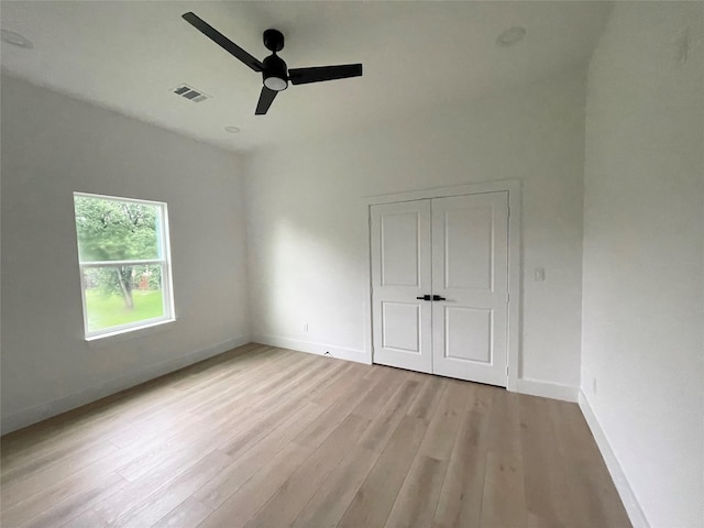 11735 Fleming Dr, Houston, TX 77013 - unfurnished bedroom with wood finished floors, a closet, and a ceiling fan
