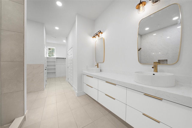 2012 Chew St, Houston, TX 77020 - full bath featuring double vanity, recessed lighting, a spacious closet, a shower, and tile patterned flooring