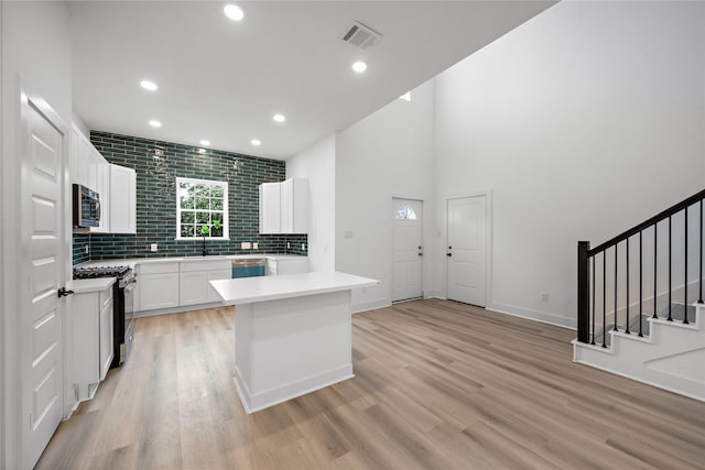 2012 Chew St, Houston, TX 77020 - kitchen with light wood-type flooring, light countertops, appliances with stainless steel finishes, and recessed lighting