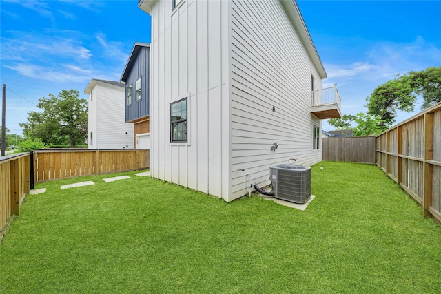 2012 Chew St, Houston, TX 77020 - rear view of house featuring board and batten siding, a fenced backyard, and a balcony