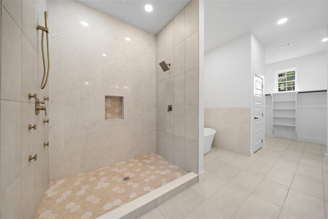 2012 Chew St, Houston, TX 77020 - full bathroom with tiled shower, a freestanding bath, tile patterned flooring, tile walls, and recessed lighting
