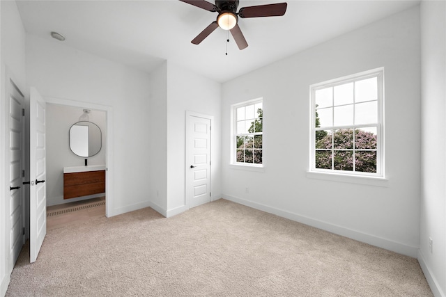 2012 Chew St, Houston, TX 77020 - unfurnished bedroom with carpet flooring, ensuite bathroom, and a ceiling fan