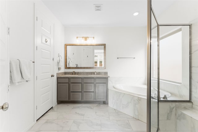 7202 Cordgrass Prairie Ln, Katy, TX 77493 - full bath with double vanity, a bath, marble look tile flooring, and recessed lighting