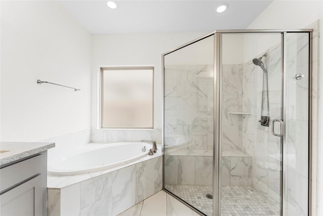 7202 Cordgrass Prairie Ln, Katy, TX 77493 - bathroom featuring a garden tub, vanity, a marble finish shower, and recessed lighting