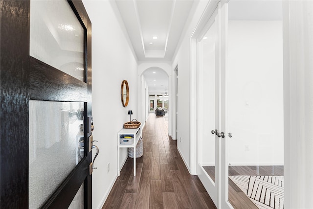 7202 Cordgrass Prairie Ln, Katy, TX 77493 - hallway with arched walkways, dark wood-style flooring, and recessed lighting