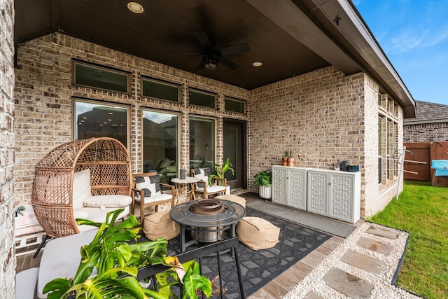 7202 Cordgrass Prairie Ln, Katy, TX 77493 - view of patio featuring ceiling fan and a fire pit