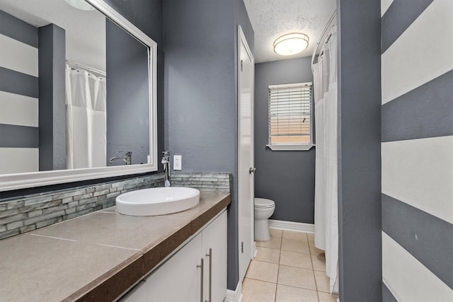 6510 Barrygate Dr, Spring, TX 77373 - bathroom featuring tile patterned floors, vanity, and tasteful backsplash