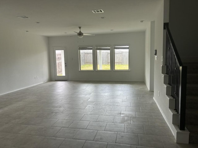 14217 Dream Rd, New Caney, TX 77357 - unfurnished living room with a ceiling fan and stairway