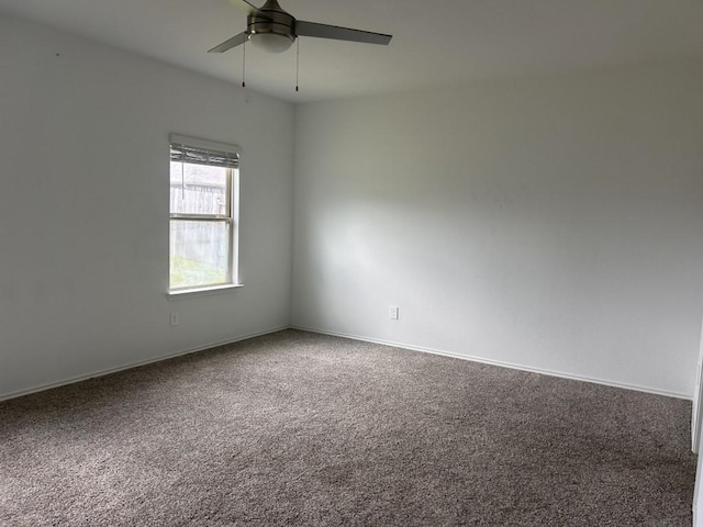 14217 Dream Rd, New Caney, TX 77357 - carpeted empty room featuring a ceiling fan and baseboards