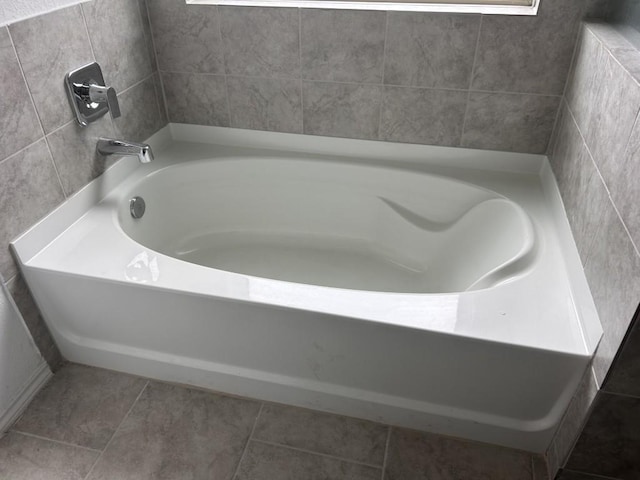 14217 Dream Rd, New Caney, TX 77357 - bathroom with a tub to relax in and tile patterned floors