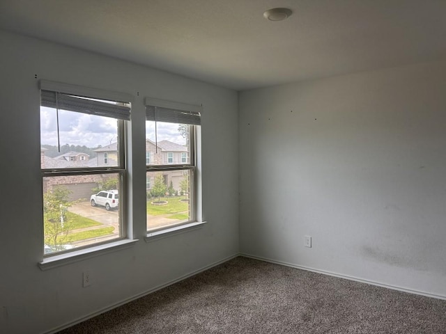 14217 Dream Rd, New Caney, TX 77357 - spare room with carpet and baseboards