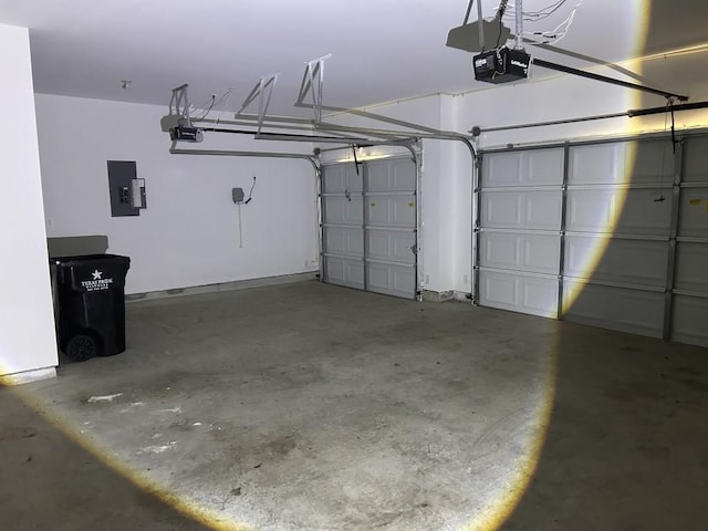 14217 Dream Rd, New Caney, TX 77357 - garage featuring electric panel and a garage door opener