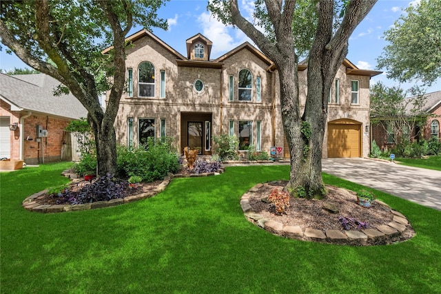2218 Lashley Ct, Katy, TX 77450 - french country inspired facade with brick siding, concrete driveway, a garage, and a front lawn