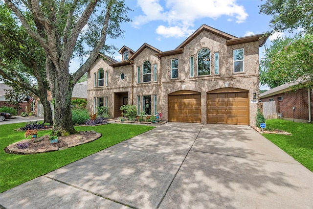 2218 Lashley Ct, Katy, TX 77450 - french country home featuring brick siding, driveway, a front lawn, and a garage
