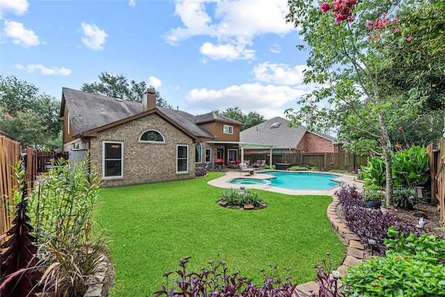 2218 Lashley Ct, Katy, TX 77450 - view of pool with a fenced backyard, a pool with connected hot tub, and a patio