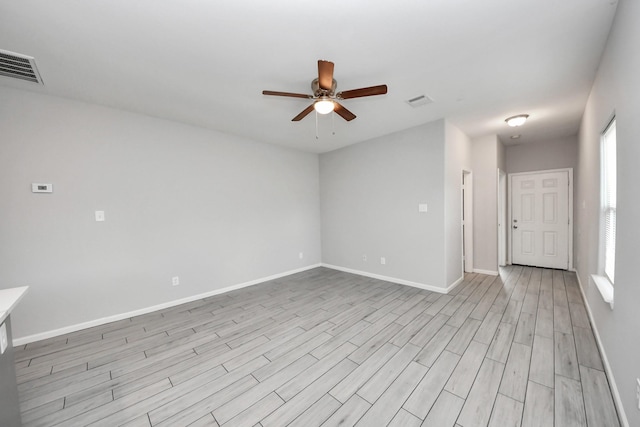 9805 Kerr, Houston, TX 77029 - unfurnished room featuring a ceiling fan, healthy amount of natural light, and light wood finished floors