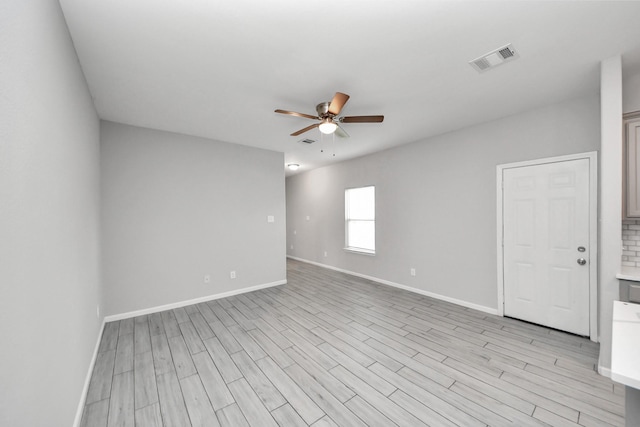 9805 Kerr, Houston, TX 77029 - empty room featuring ceiling fan and light wood-style flooring