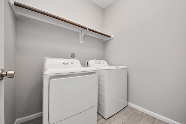 9805 Kerr, Houston, TX 77029 - laundry room featuring independent washer and dryer and light wood-type flooring