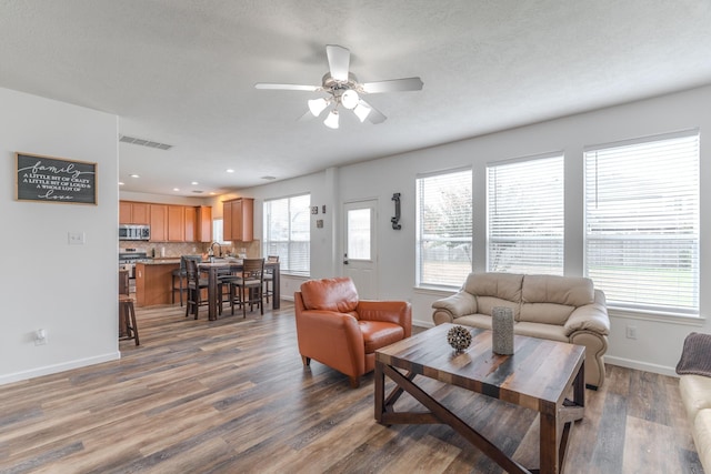 3618 Avalon Spring Ln, Spring, TX 77386 - living area with a ceiling fan, wood finished floors, and recessed lighting