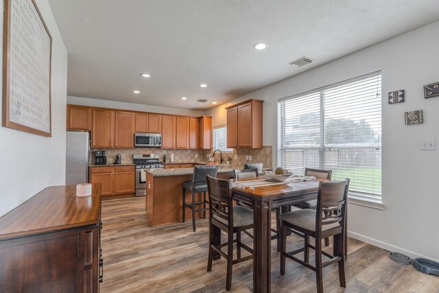 3618 Avalon Spring Ln, Spring, TX 77386 - dining space featuring light wood-style flooring and recessed lighting
