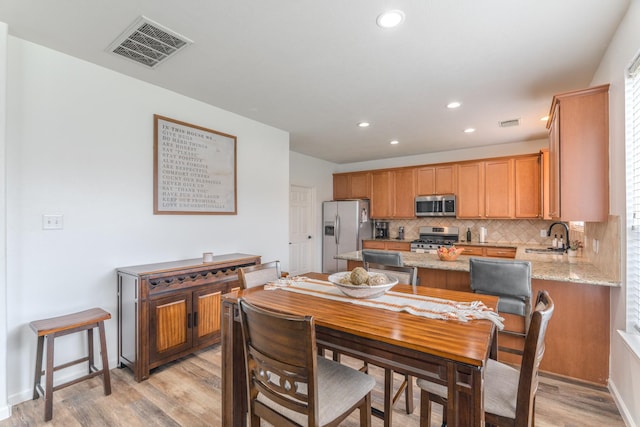 3618 Avalon Spring Ln, Spring, TX 77386 - dining space with light wood finished floors and recessed lighting