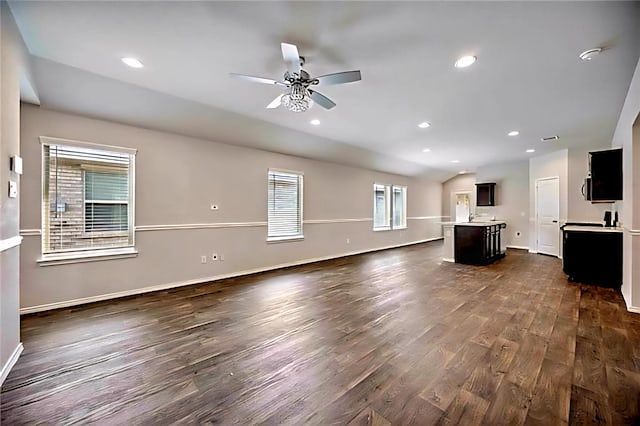 22835 Berthoud Trl, Spring, TX 77373 - unfurnished living room featuring dark wood-style flooring, ceiling fan, and recessed lighting