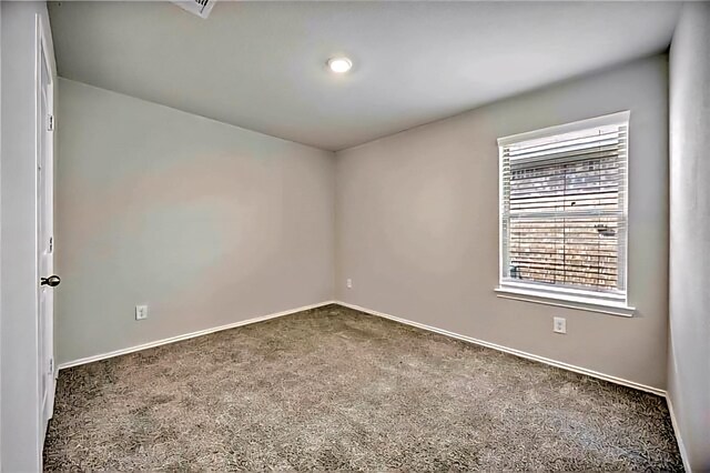 22835 Berthoud Trl, Spring, TX 77373 - spare room featuring dark carpet and baseboards