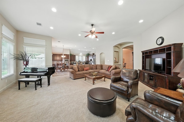 4118 Sage Brush Ct, Manvel, TX 77578 - living room with light colored carpet, arched walkways, a ceiling fan, recessed lighting, and healthy amount of natural light