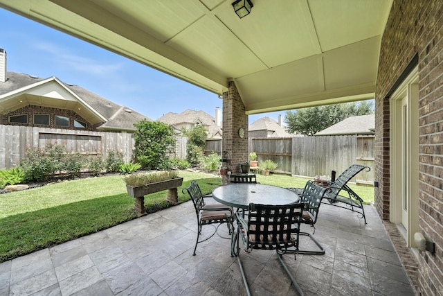 4118 Sage Brush Ct, Manvel, TX 77578 - fenced backyard featuring outdoor dining space and a patio