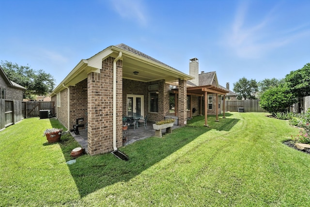 4118 Sage Brush Ct, Manvel, TX 77578 - rear view of property with brick siding, a fenced backyard, and a patio area