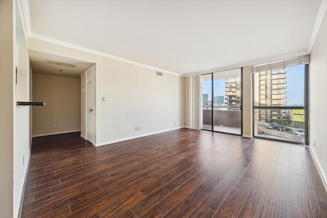3525 Sage Rd Unit 805, Houston, TX 77056 - unfurnished room featuring wood finished floors, crown molding, floor to ceiling windows, and a city view