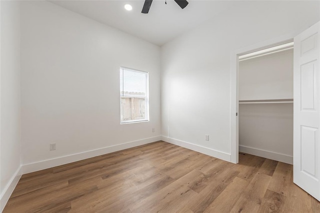 9727 Cargill St Unit A, Houston, TX 77029 - unfurnished bedroom featuring light wood-type flooring, a closet, and a ceiling fan