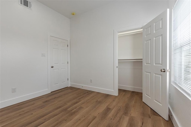 9727 Cargill St Unit A, Houston, TX 77029 - unfurnished bedroom featuring light wood-type flooring and a closet
