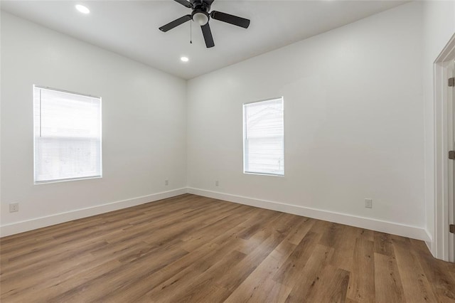 9727 Cargill St Unit A, Houston, TX 77029 - empty room featuring wood finished floors, a ceiling fan, and recessed lighting