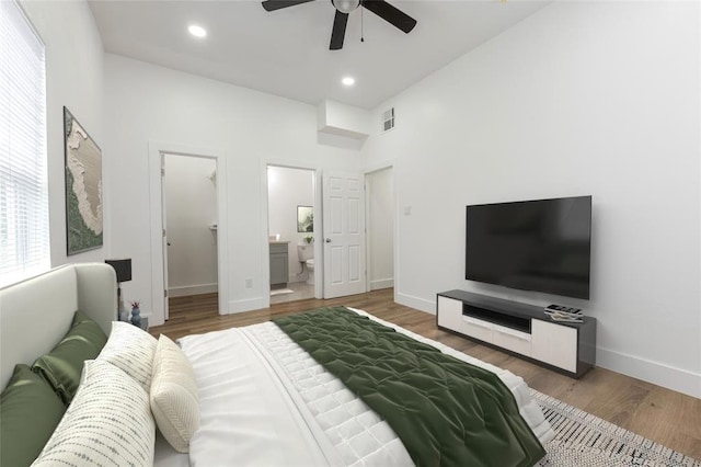 9727 Cargill St Unit A, Houston, TX 77029 - bedroom featuring a walk in closet, wood finished floors, ensuite bathroom, recessed lighting, and a ceiling fan