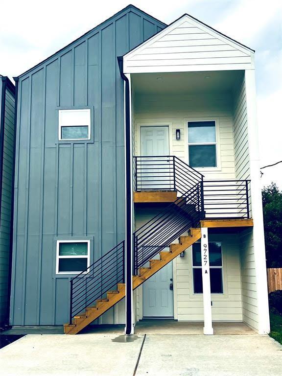 9727 Cargill St Unit A, Houston, TX 77029 - view of front of house featuring board and batten siding and stairs