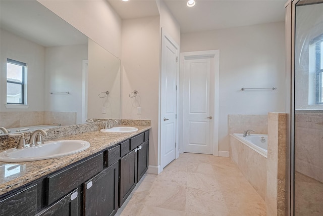 9027 Laverne Cres, Houston, TX 77080 - bathroom featuring a bath, double vanity, and a shower with door