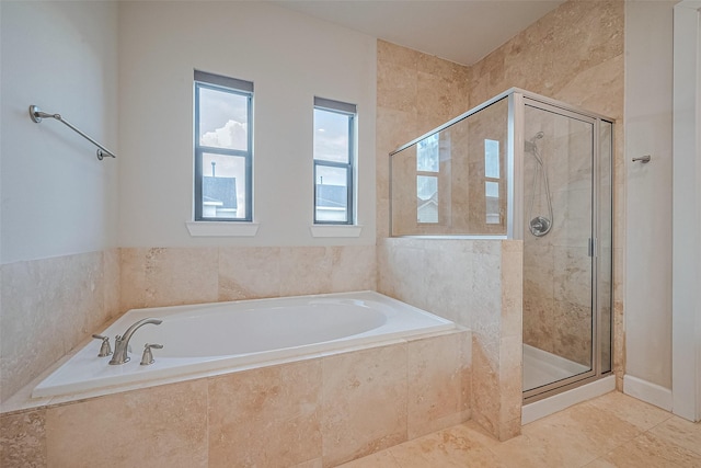 9027 Laverne Cres, Houston, TX 77080 - bathroom featuring a stall shower, a bath, and tile patterned flooring